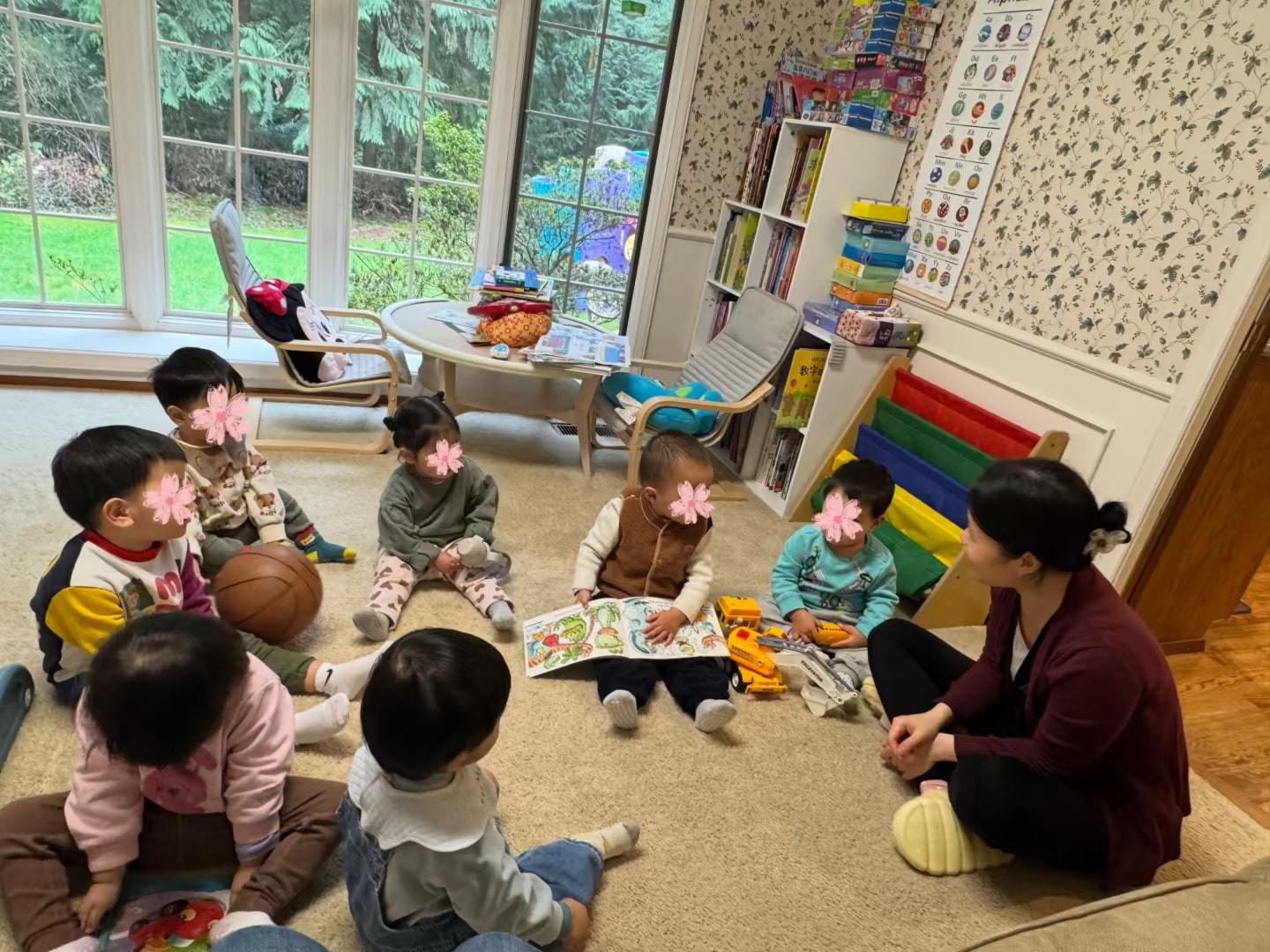 Panda Bear Childcare — teacher reading to young children classroom circle
