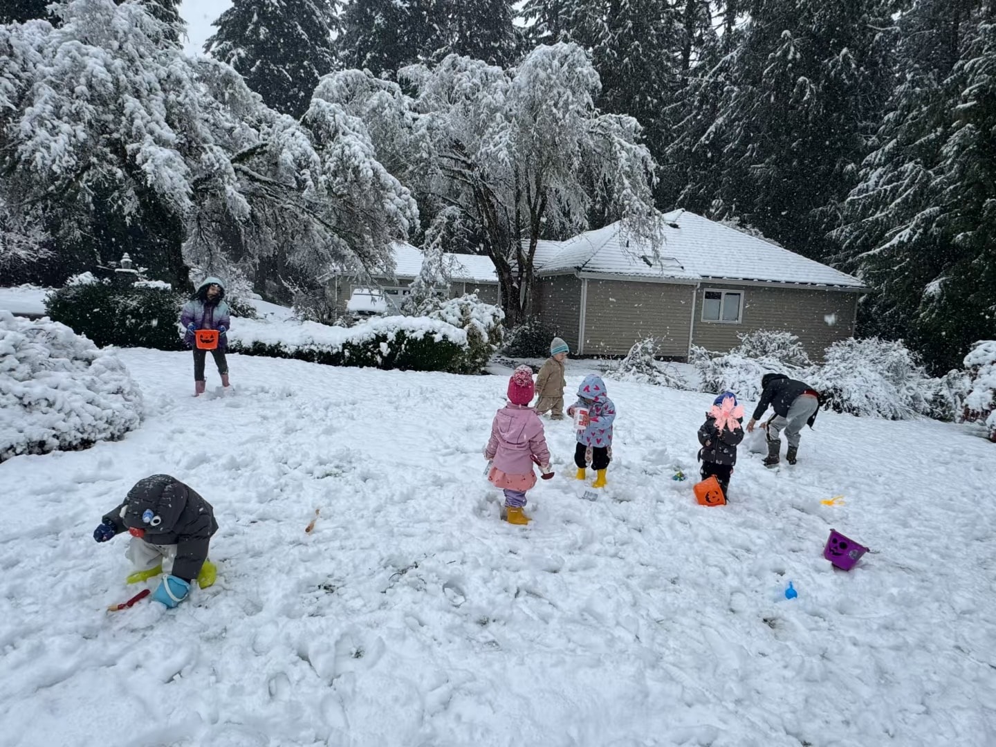 Panda Bear Childcare — children playing in snowy yard